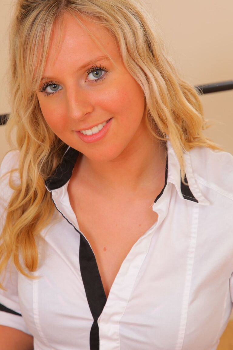 21P Beautiful babe Emma C flashes her tiny tits while donning workout clothes