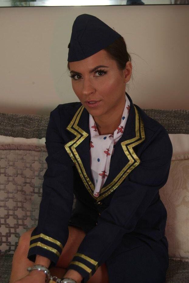 16P Flight attendant hitches up her skirt while struggling against handcuffs