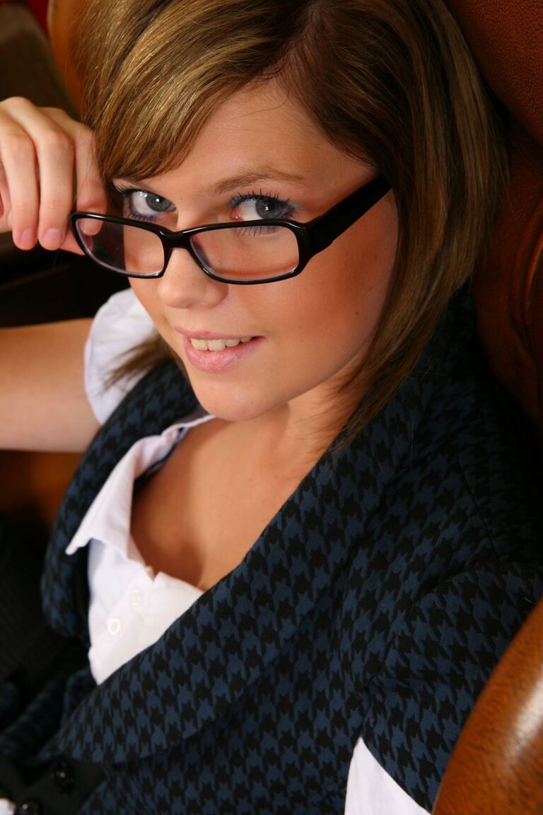 21P Short haired secretary Laura H climbs on the office desk & strips to pantyhose