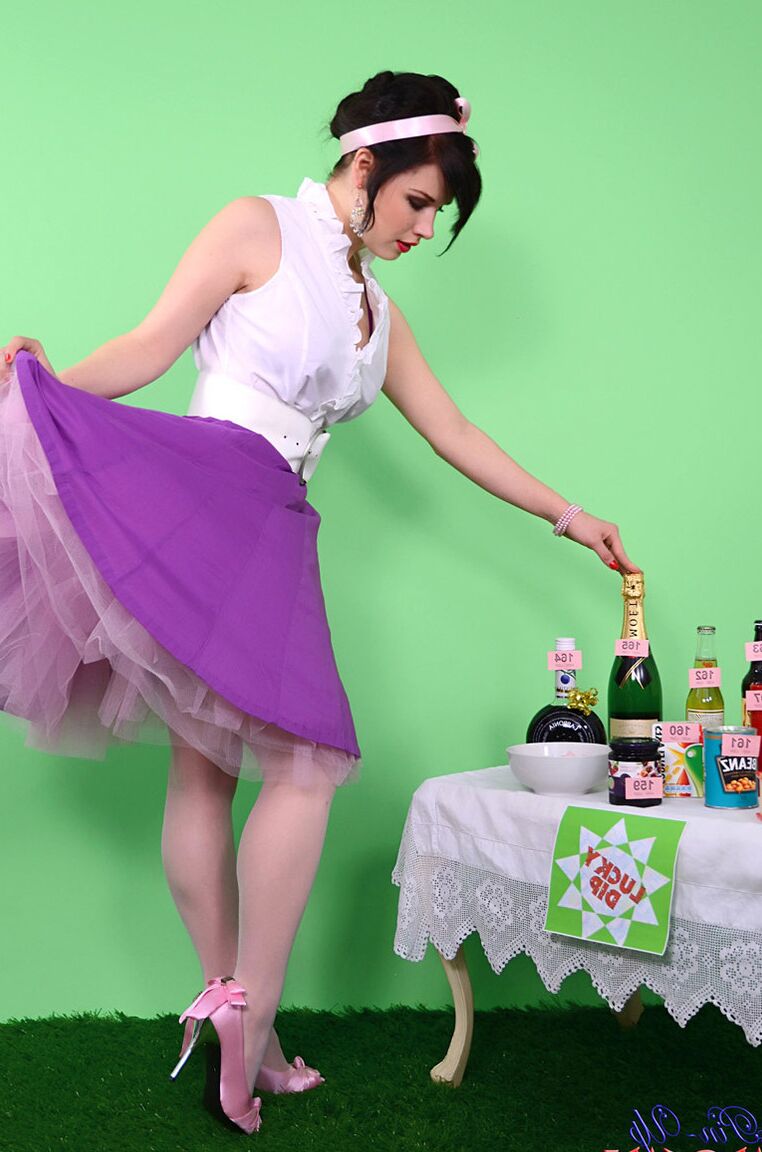 17P Pinup model Jocelyn-Kay lets her hair down before uncupping her nice breasts