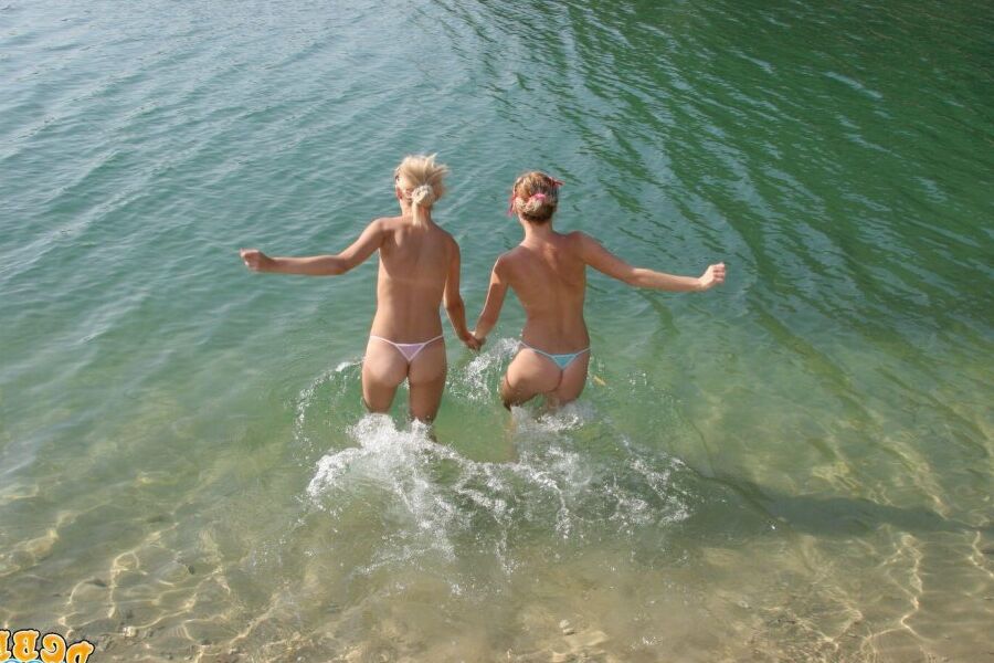 15P Blonde girls hump each other while going topless on a private beach