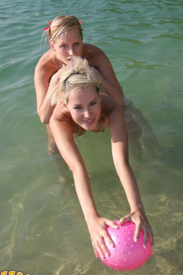 15P Blonde girls hump each other while going topless on a private beach