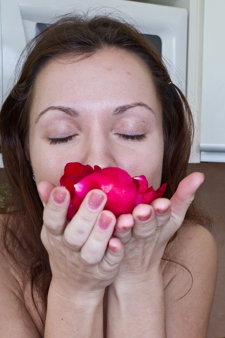 21P Petite babe with a hairy crotch Roxy shows her small tits & plays with a rose