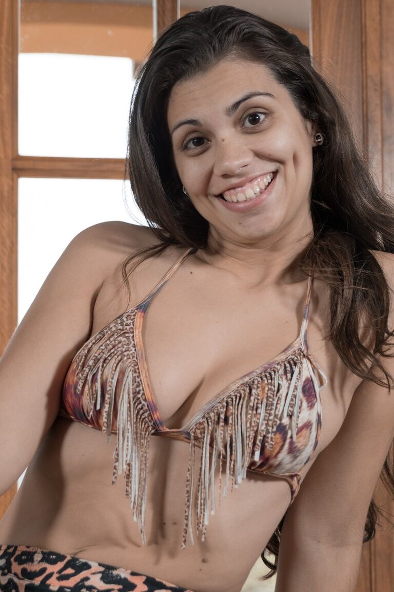 21P Gorgeous brunette with a big smile Camille S showing her hairy pussy up close
