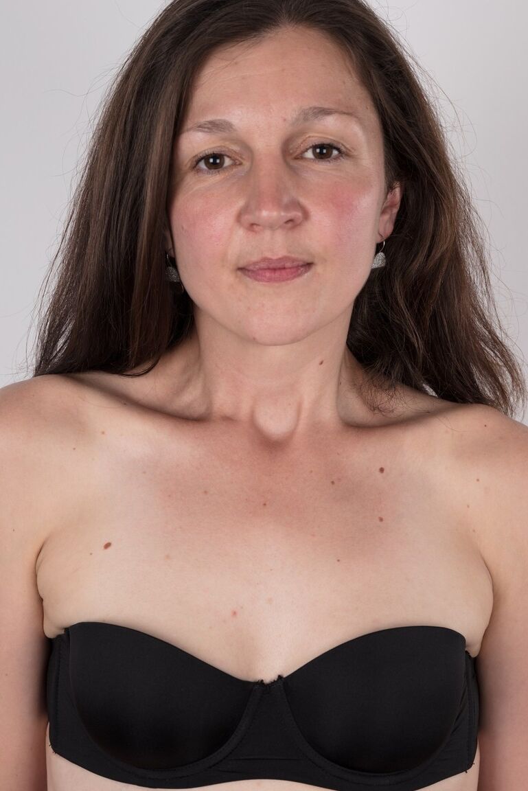 19P First timer Petra holds her face firm as she takes off her clothes