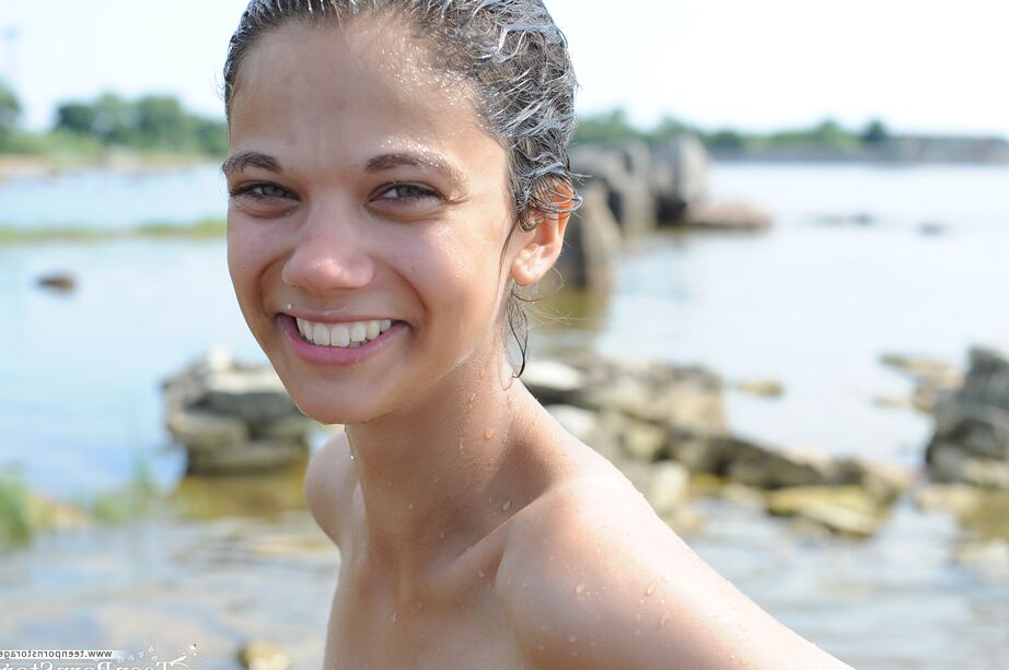 20P Naked amateur Tina immerses her body in shallow water near the shore