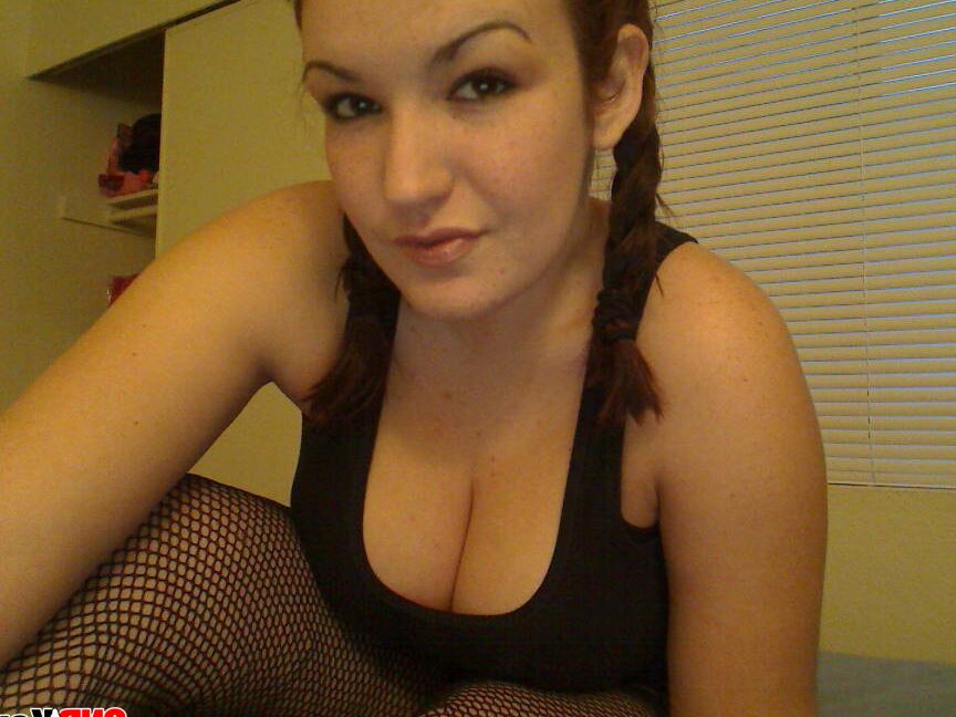 12P Kayla pulls down her top to show off her massive perky tits