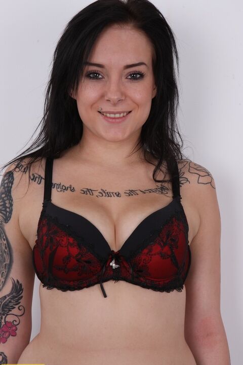 20P Tattooed amateur stands clothed in bare feet before getting butt naked