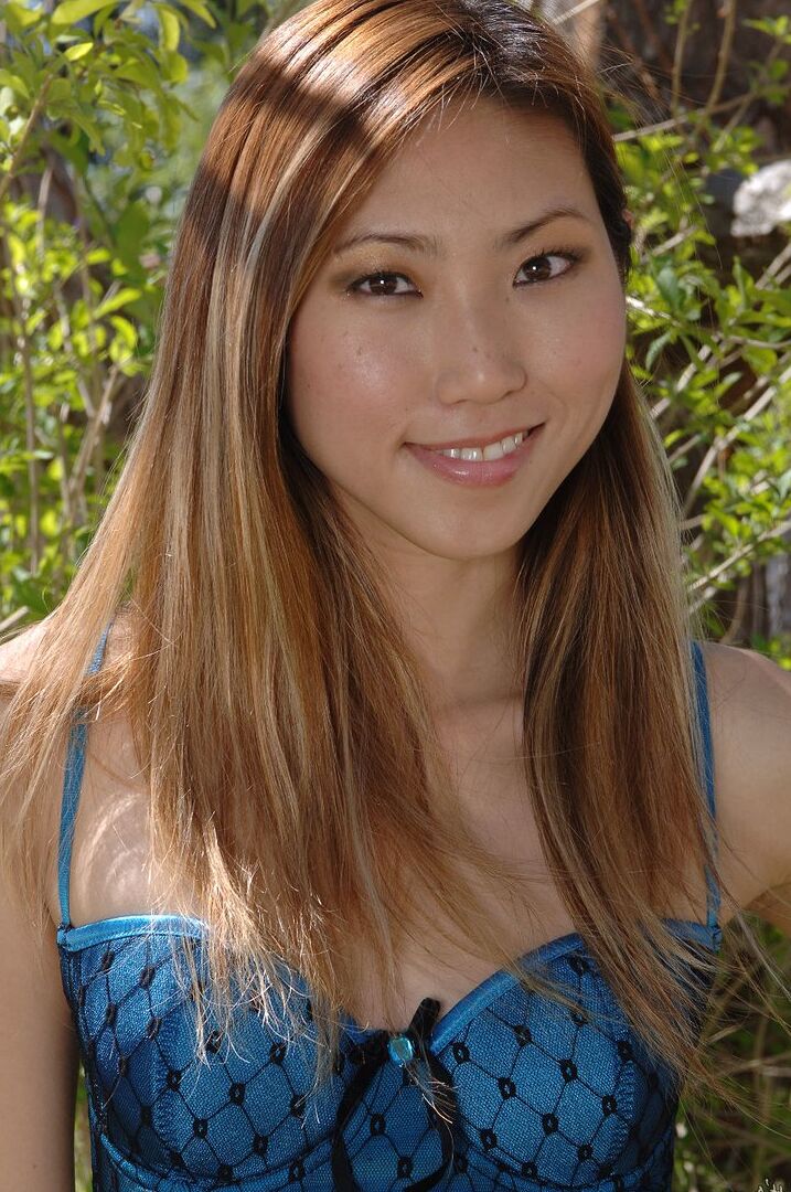 16P Asian girl with a pretty face blows a kiss after getting naked in the backyard
