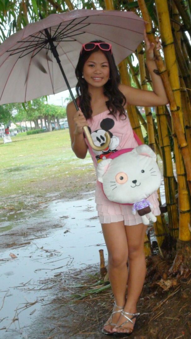 15P Asian amateur holds an umbrella in the rain before a hard POV fuck indoors