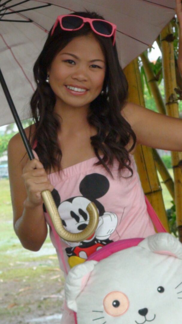 15P Asian amateur holds an umbrella in the rain before a hard POV fuck indoors