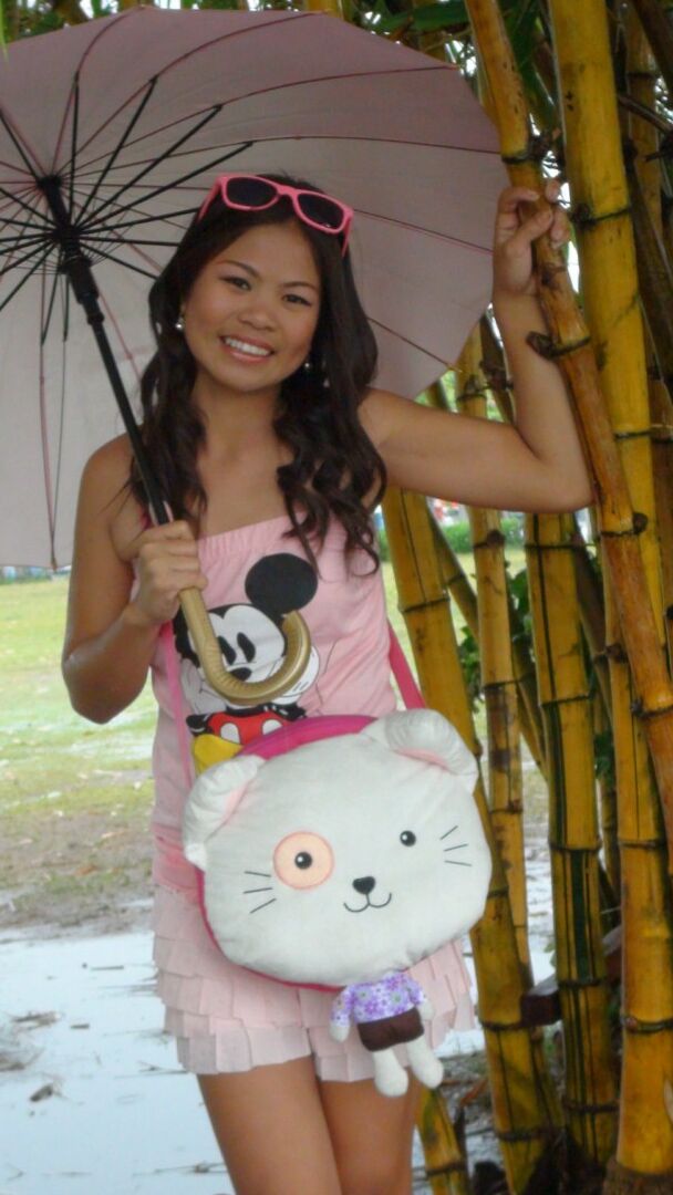 15P Asian amateur holds an umbrella in the rain before a hard POV fuck indoors