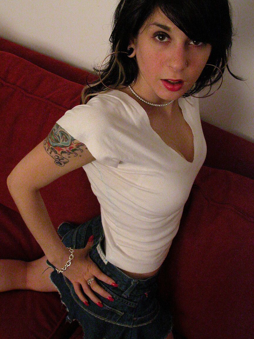 17P Hot and sexy dark haired chick showing tatts and body in solo action