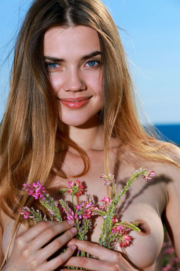 18P Nice teen Georgia gets totally naked while in a patch of wildflowers