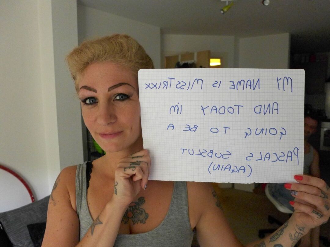12P Tattooed blonde Miss Trixx gets on her knees in front of a man while naked