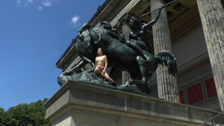 15P Caucasian girl strolls naked through a square before having sex in public
