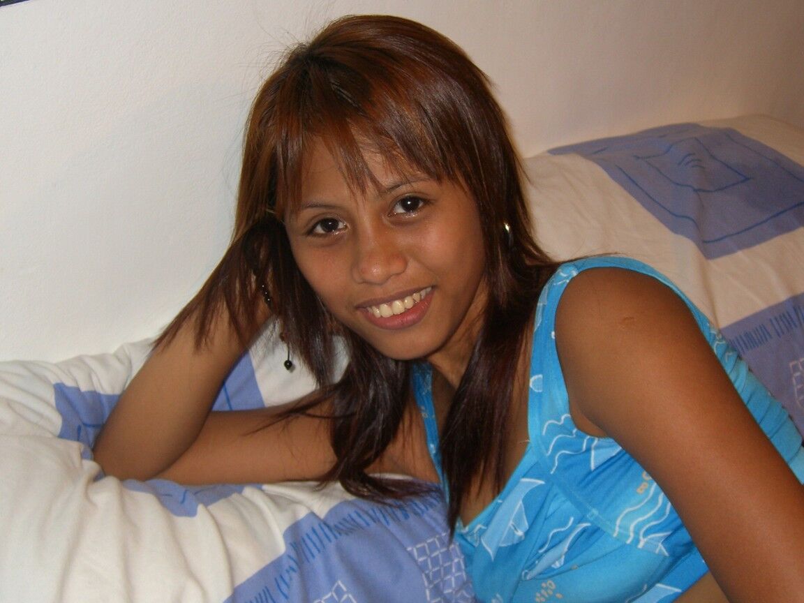 14P Filipina redhead sticks out her tongue before making her nude modelling debut