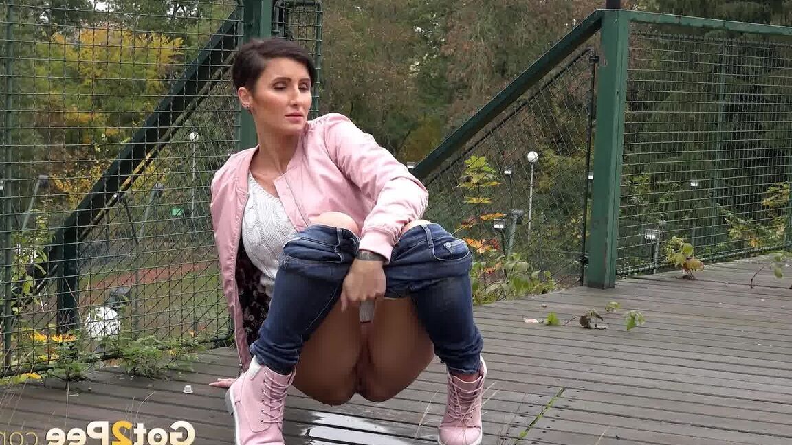 15P Short haired female Gabriellla Gucci squats foe a peen on a public crossover