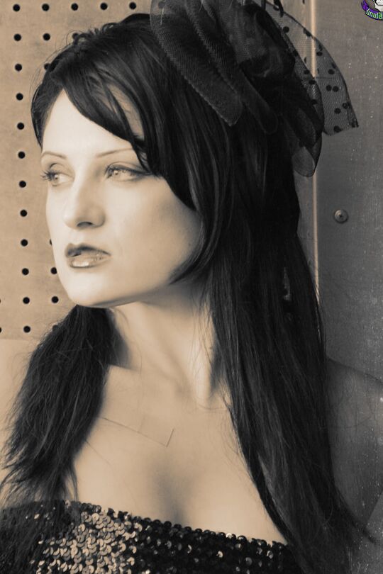 15P Goth model Annika Amour strikes tempting poses during a black and white shoot