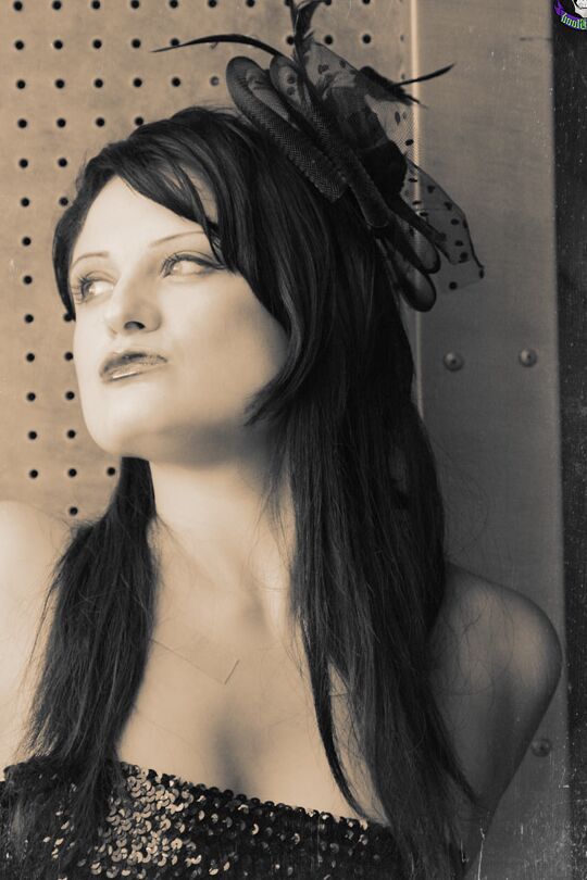 15P Goth model Annika Amour strikes tempting poses during a black and white shoot