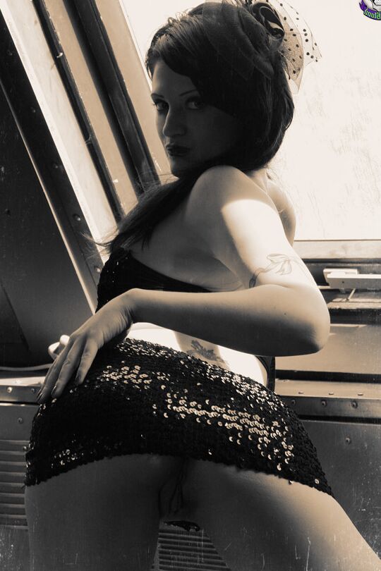 15P Goth model Annika Amour strikes tempting poses during a black and white shoot