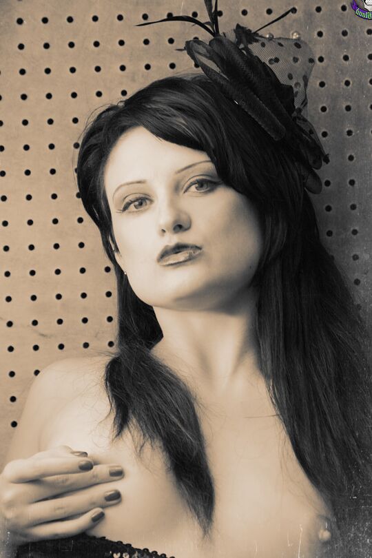 15P Goth model Annika Amour strikes tempting poses during a black and white shoot