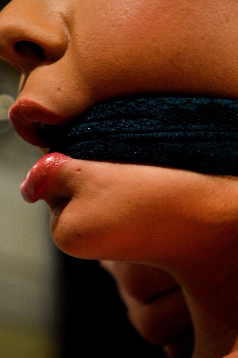 12P Girl with dark hair has her boobs exposed after being gagged and bound
