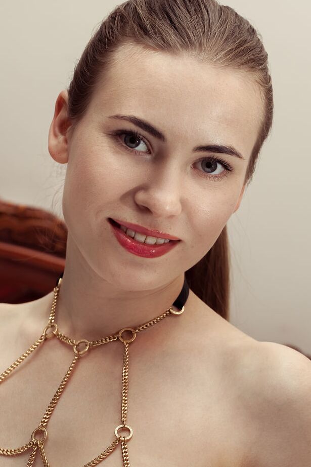 18P Glamour model Alaine removes chain lingerie to get totally naked