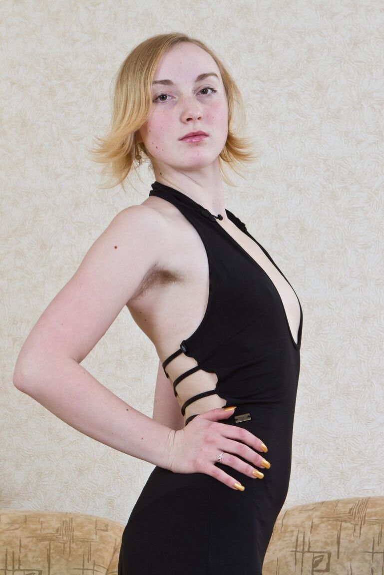 11P Thin solo model exposes her unshaven armpits and bush as she undresses