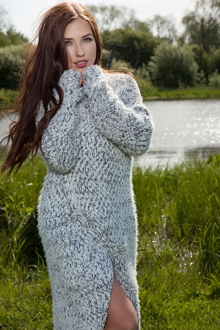 16P Beautiful female Niemira removes a knitted dress to pose nude in a field