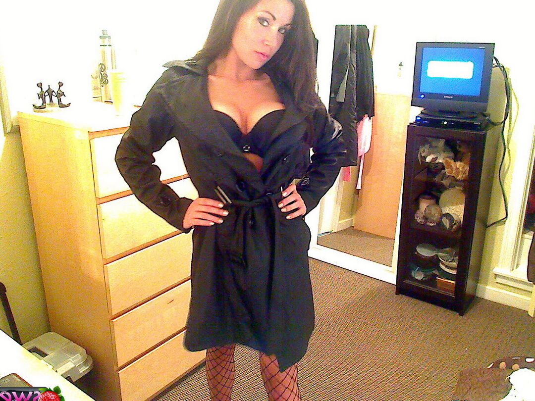 12P Krissys big juicy tits can barely fit in her bra as she opens her trench coat