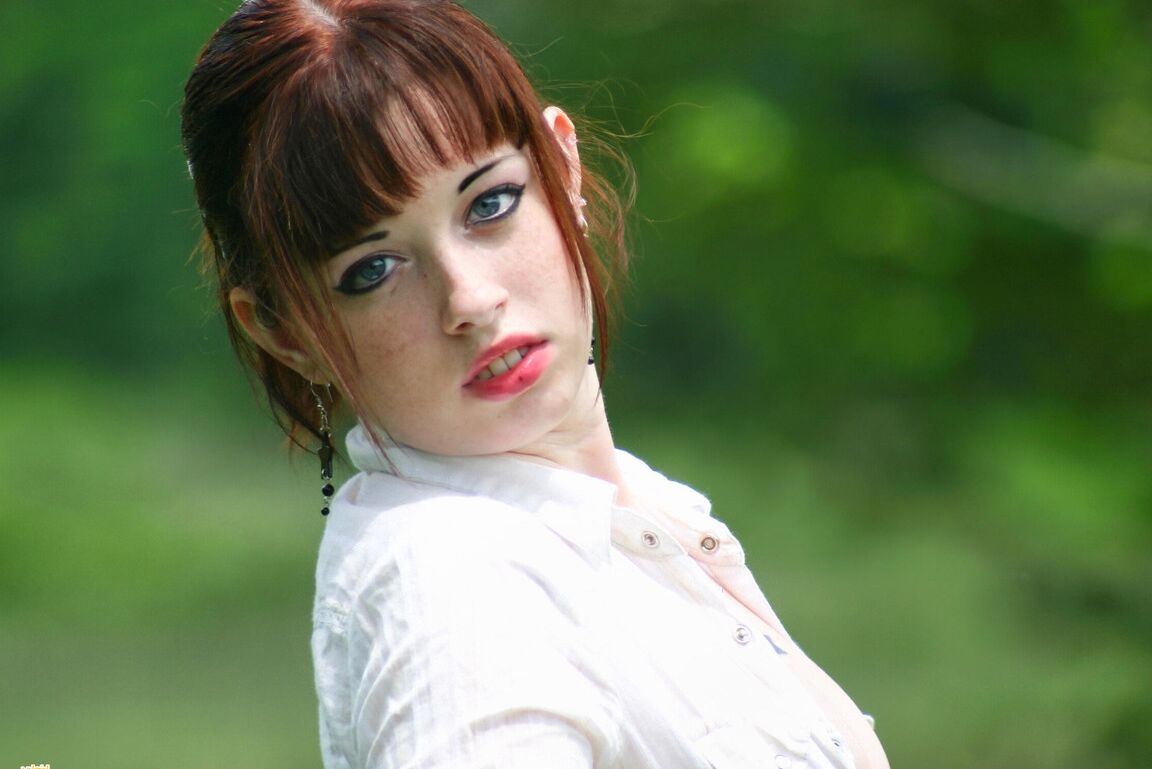 12P Amateur girl with red hair Barbie A exposes her tits while in a grassy field
