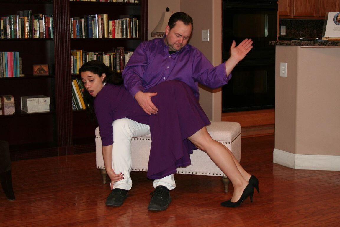 15P Dark haired girl Mackenzie Reed has her ass turned red during an OTK spanking
