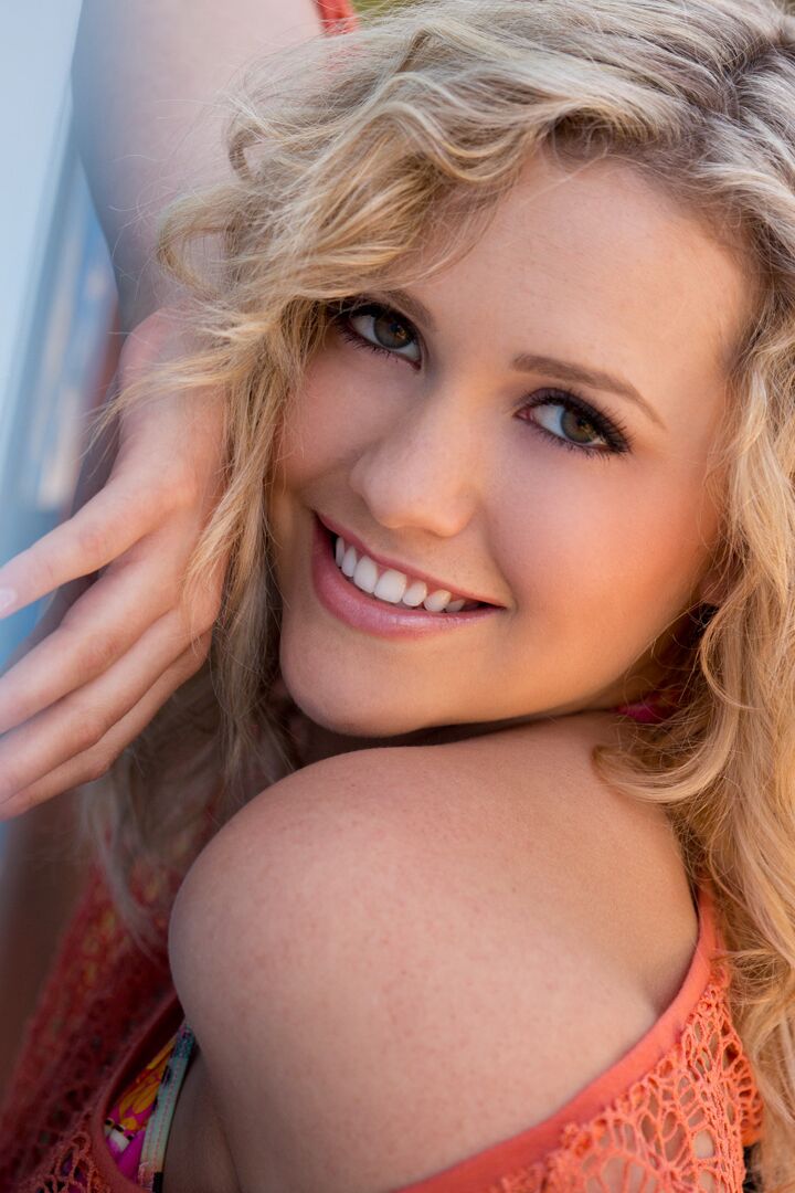 15P Beautiful blonde Mia Malkova goes topless on a sofa while in a backyard