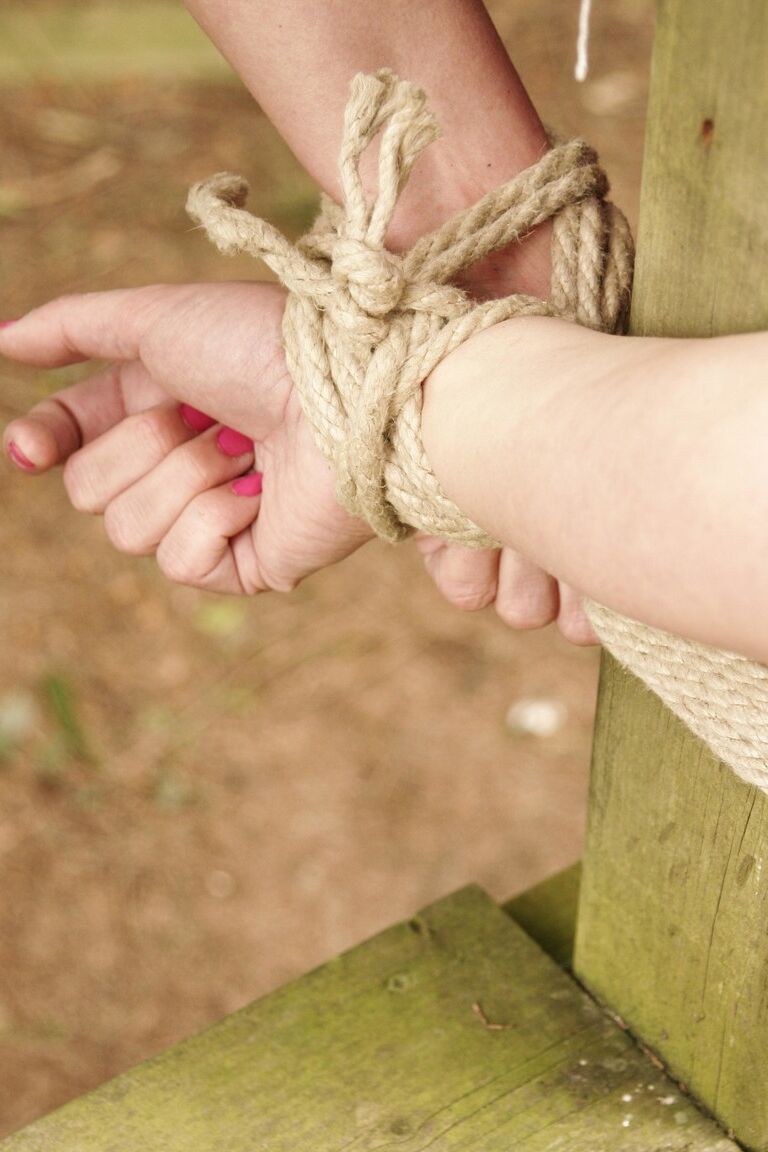 17P Stacked blonde Deedee tied up with rope & gagged outdoors with her tits bared