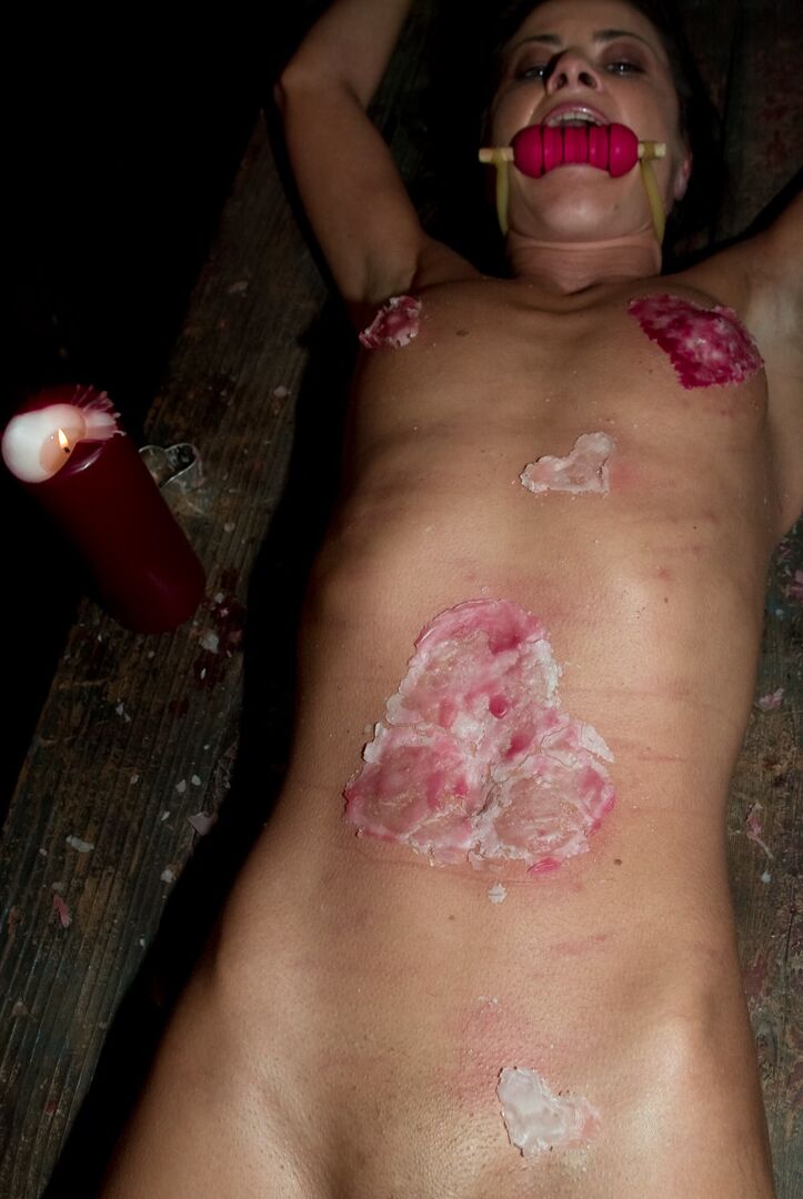 17P A gagged and restrained Cecilia Vegais is covered in heart shaped wax