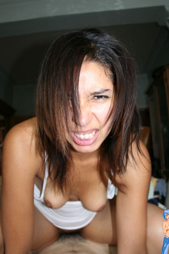 14P Brunette chick scrunches up her face during hard anal penetration on a bed
