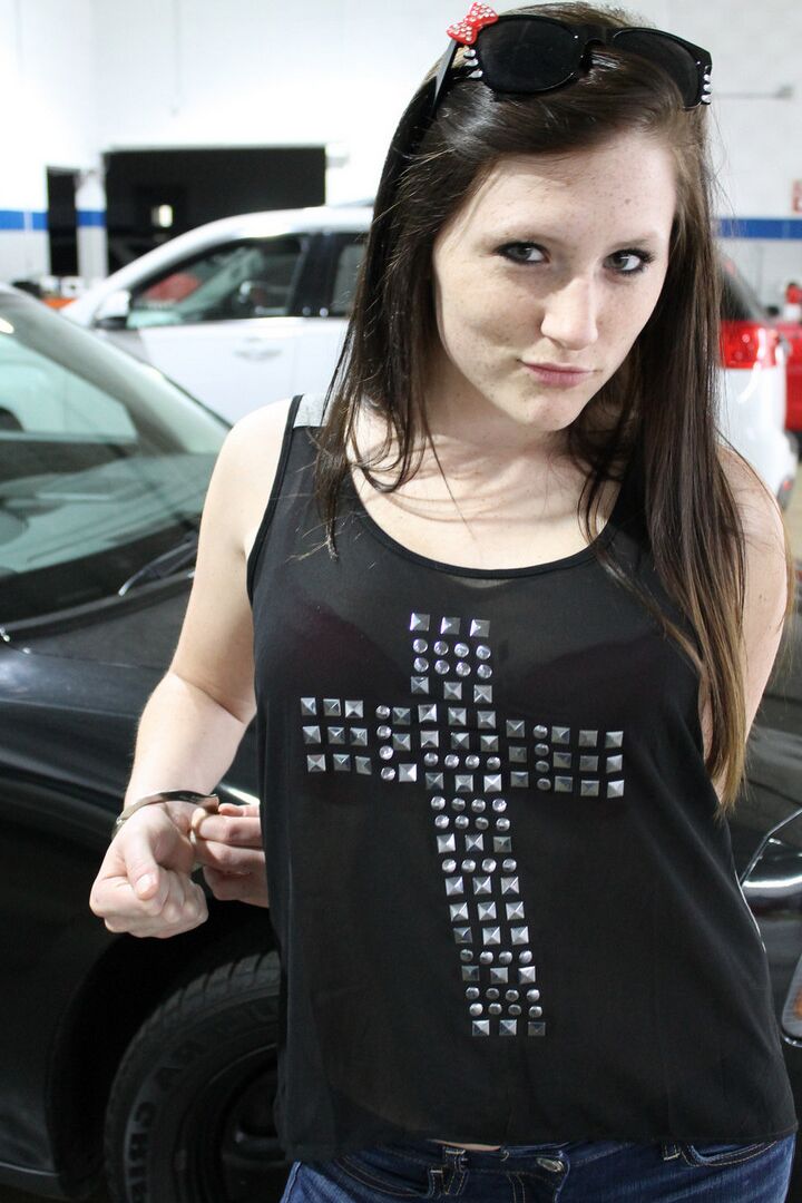 12P Teen amateur Freckles 18 strips to a red bra and thong inside an auto shop
