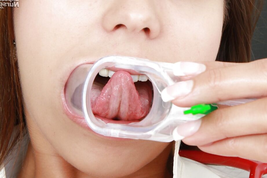 16P Foxy nurse in stockings stretching her cunt with a speculum