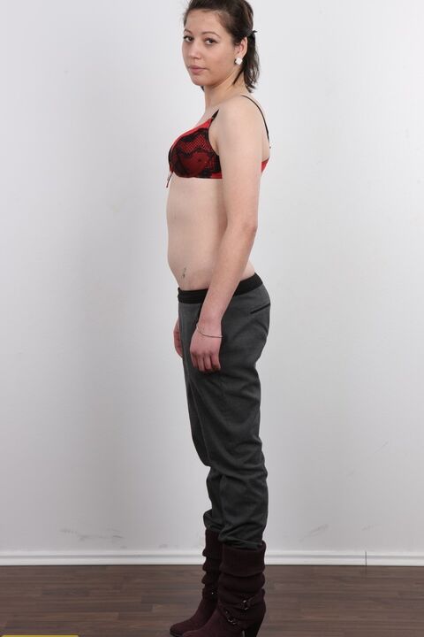 20P Amateur girl Michala sits on a stool after divesting herself of clothes