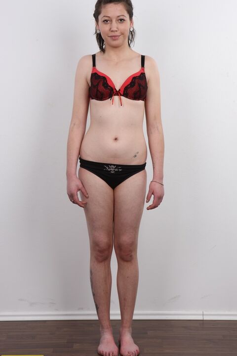 20P Amateur girl Michala sits on a stool after divesting herself of clothes