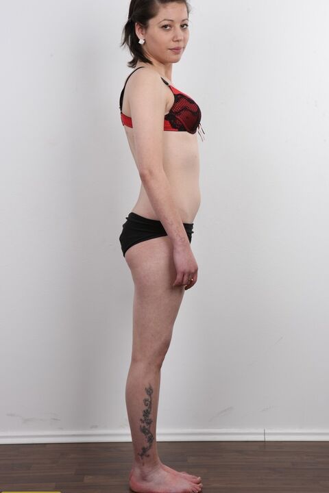 20P Amateur girl Michala sits on a stool after divesting herself of clothes