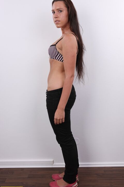 20P First timer with long hair Denisa gets completely naked in front of a wall