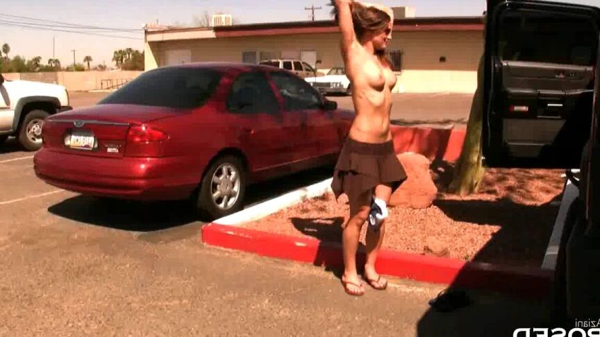 15P Female exhibitionist Misty Anderson gets naked while changing in a parking lot