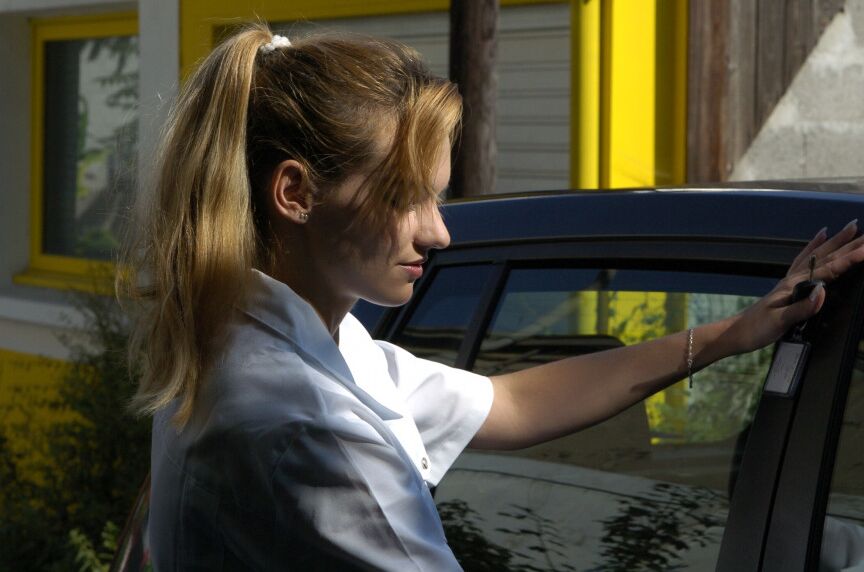 16P Clothed girl shows her stocking tops after getting behind the wheel of a car