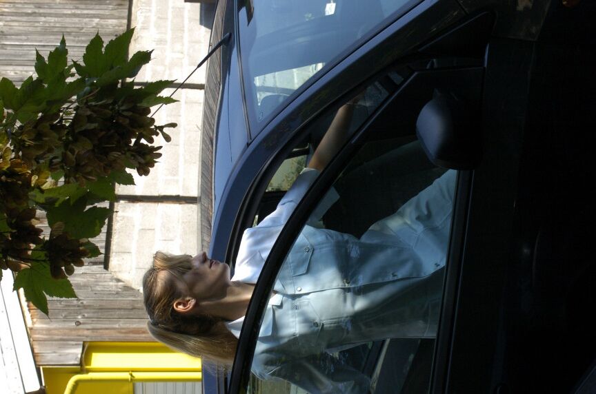 16P Clothed girl shows her stocking tops after getting behind the wheel of a car