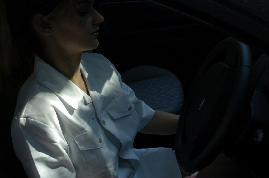 16P Clothed girl shows her stocking tops after getting behind the wheel of a car