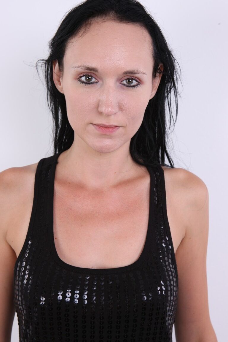 20P Dark haired girl Marcela takes a seat on a stool after getting totally naked