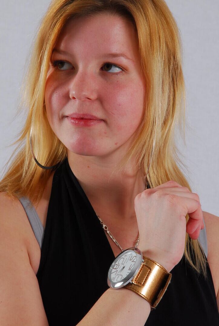 16P Kylie wearing her own Geneva huge cuff watch