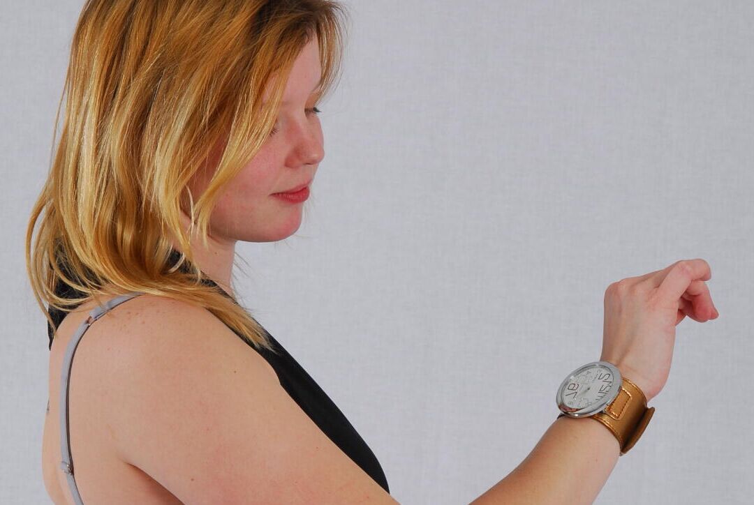 16P Kylie wearing her own Geneva huge cuff watch